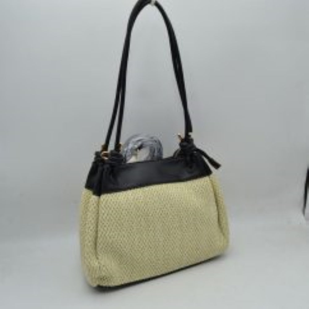 Black Embrace a relaxed yet sophisticated aesthetic with this beautifully textured shoulder bag. The design prominently features a classic woven mesh panel across the main body, paired seamlessly with smooth trim along the upper edge and base. Dual slender shoulder straps attach to the bag with elegant, integrated knot details at the base, offering a comfortable drop for easy over-the-shoulder carrying. Adding to its versatile utility, a small, matching clip-on zippered pouch hangs from the side hardware