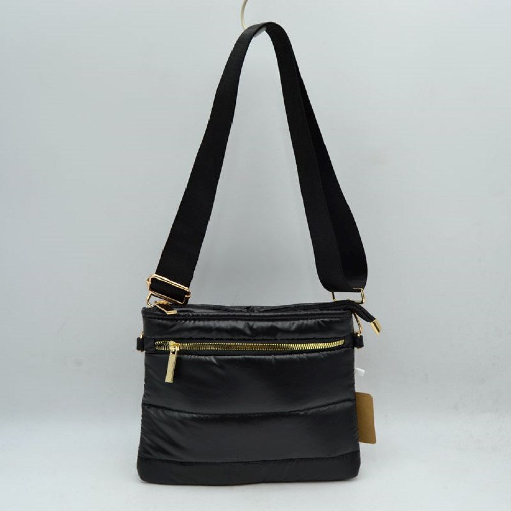 Black Stay organized in style with the sporty, lightweight crossbody bag. Combining a trendy puffer design with everyday functionality, this low-profile pouch is perfect for travel, running errands, or keeping your hands free on the go.