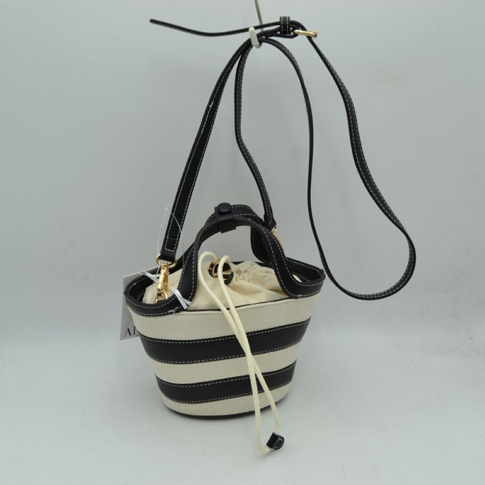 Black Add a touch of playful charm to your everyday look with this chic striped mini bucket bag. Blending casual canvas texturing with clean, structured contrasting trim, this bag offers a contemporary twist on the classic nautical aesthetic. Perfect for casual weekend outings, summer travel, or day trips, its compact bucket silhouette keeps you organized while standing out as a statement accessory