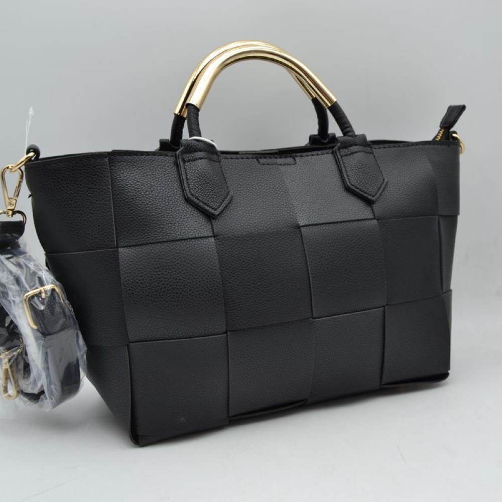 Black Make a sophisticated statement with this beautifully designed satchel handbag. The exterior showcases an eye-catching, extra-wide basket-weave pattern that adds modern texture and dimensional depth to a classic silhouette. Setting this piece apart is the sleek, polished metallic accent arched over the top carry handles, bringing an upscale, architectural touch to your look. Equipped with soft, flexible side panels