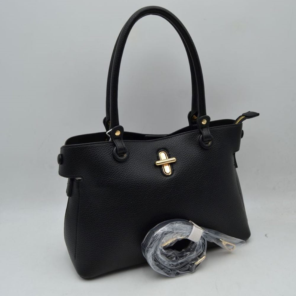 Black This everyday handbag features a structured silhouette with a distinctively textured exterior surface. Designed for versatile carrying options, it includes dual rounded top handles attached via metallic hardware studs alongside a separate, detachable shoulder strap. The front panel is accented with a prominent metallic turn-lock closure detail.