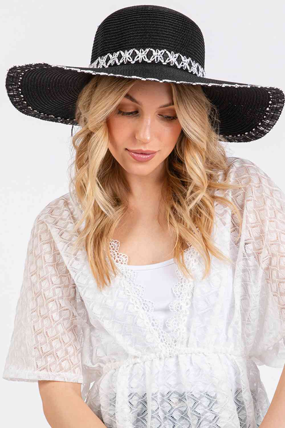 Black Embrace effortless summer style with this wide-brim floppy straw hat, designed to keep you cool and protected. Crafted from 100% paper, the lightweight construction makes it perfect for beach days, outdoor adventures, and sunny getaways.