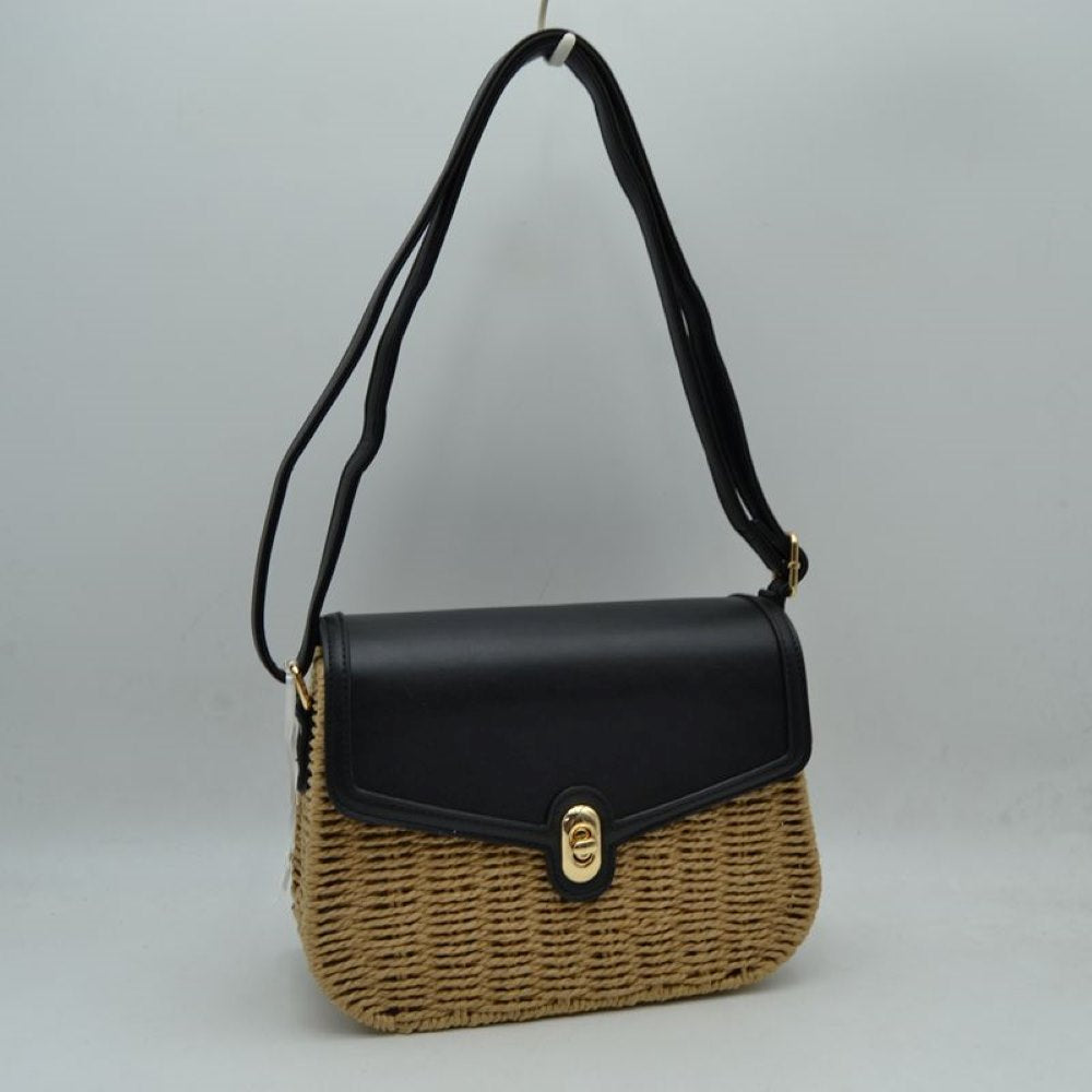 Black Embrace warm-weather sophistication with this beautiful mixed-media shoulder bag. Effortlessly blending the rustic, organic charm of a woven straw basket body with a smooth, structured faux-leather flap enclosure, this bag is a must-have accessory for casual sunny days, resort vacations, or stylish weekend brunches. Its elegant silhouette offers a refined twist on classic beachwear aesthetics, transitioning perfectly from a day in the sun to an evening out.
