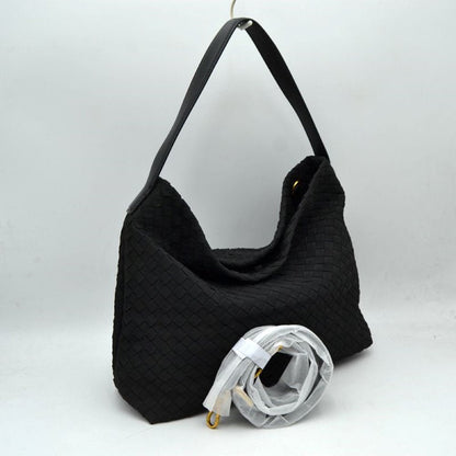 Black This slouchy hobo bag showcases a textured woven pattern across its exterior, offering a refined look that is perfect for everyday use. The spacious main compartment provides ample storage for daily essentials, featuring a relaxed silhouette with a flat top shoulder strap for comfortable carrying. A separate, detachable secondary strap with metallic clasps is included, allowing for versatile styling options to suit your needs.