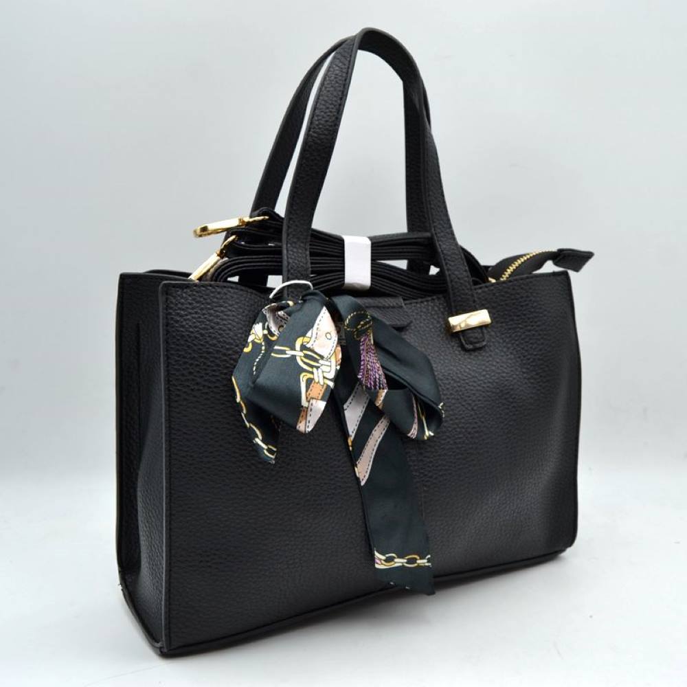 Black This structured everyday tote bag features a distinct pebbled textured body designed for organized daily use. It offers a spacious main compartment equipped with a secure top zipper closure alongside a detached, adjustable shoulder strap that attaches via polished metal hardware. Flat double top handles are anchored neatly to the front and back panels with metallic hardware accents