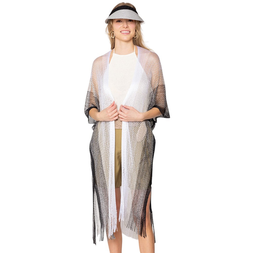 Black Two Tone Lurex Kimono Poncho is a versatile and stylish addition to any wardrobe. Made with a unique Lurex fabric, it adds a touch of shimmer to your outfit. Its kimono design offers a comfortable and flattering fit, making it suitable for any body type. Perfect for adding a pop of color and sparkle to your outfit. 