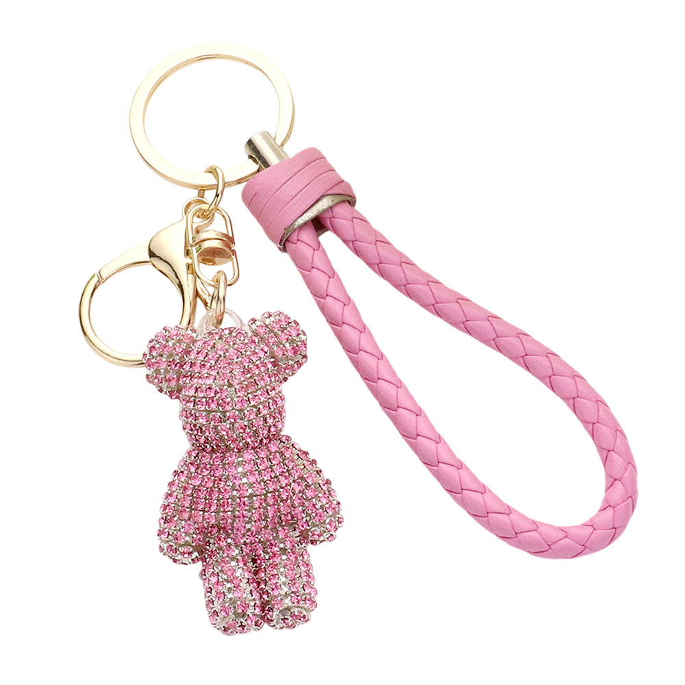 pink Bling Bear Figure Faux Leather Strap Bag Charm adds a touch of sparkle and cuteness to your keys or bag. The bling bear figure is encrusted with rhinestones, making it a unique and eye-catching accessory. The faux leather strap adds durability, ensuring you'll have this keychain for years to come. 