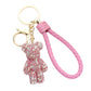 Multi Pink Bling Bear Figure Faux Leather Strap Bag Charm adds a touch of sparkle and cuteness to your keys or bag. The bling bear figure is encrusted with rhinestones, making it a unique and eye-catching accessory. The faux leather strap adds durability, ensuring you'll have this keychain for years to come. 