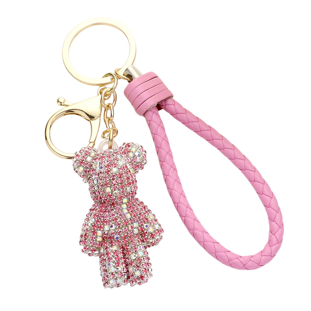 Multi Pink Bling Bear Figure Faux Leather Strap Bag Charm adds a touch of sparkle and cuteness to your keys or bag. The bling bear figure is encrusted with rhinestones, making it a unique and eye-catching accessory. The faux leather strap adds durability, ensuring you'll have this keychain for years to come. 