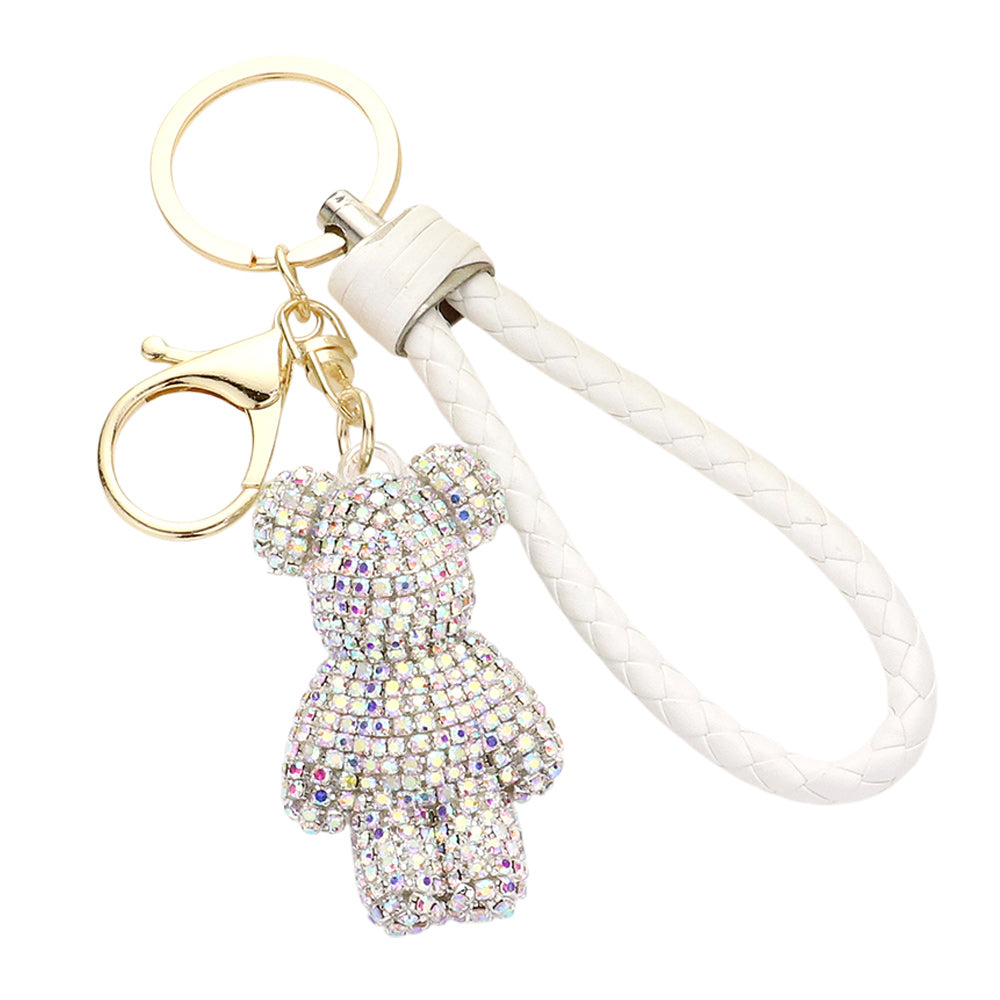 White Bling Bear Figure Faux Leather Strap Bag Charm adds a touch of sparkle and cuteness to your keys or bag. The bling bear figure is encrusted with rhinestones, making it a unique and eye-catching accessory. The faux leather strap adds durability, ensuring you'll have this keychain for years to come. 