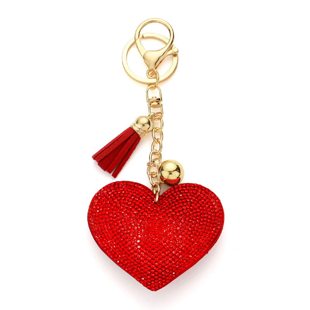 Red Bling Heart Tassel Bag Charm adds a touch of luxury and glamour to any bag. The dazzling heart design and tassel detail make it a perfect accessory for any fashion-forward individual. Crafted with precision, this bag charm is a must-have for those who appreciate quality and style.