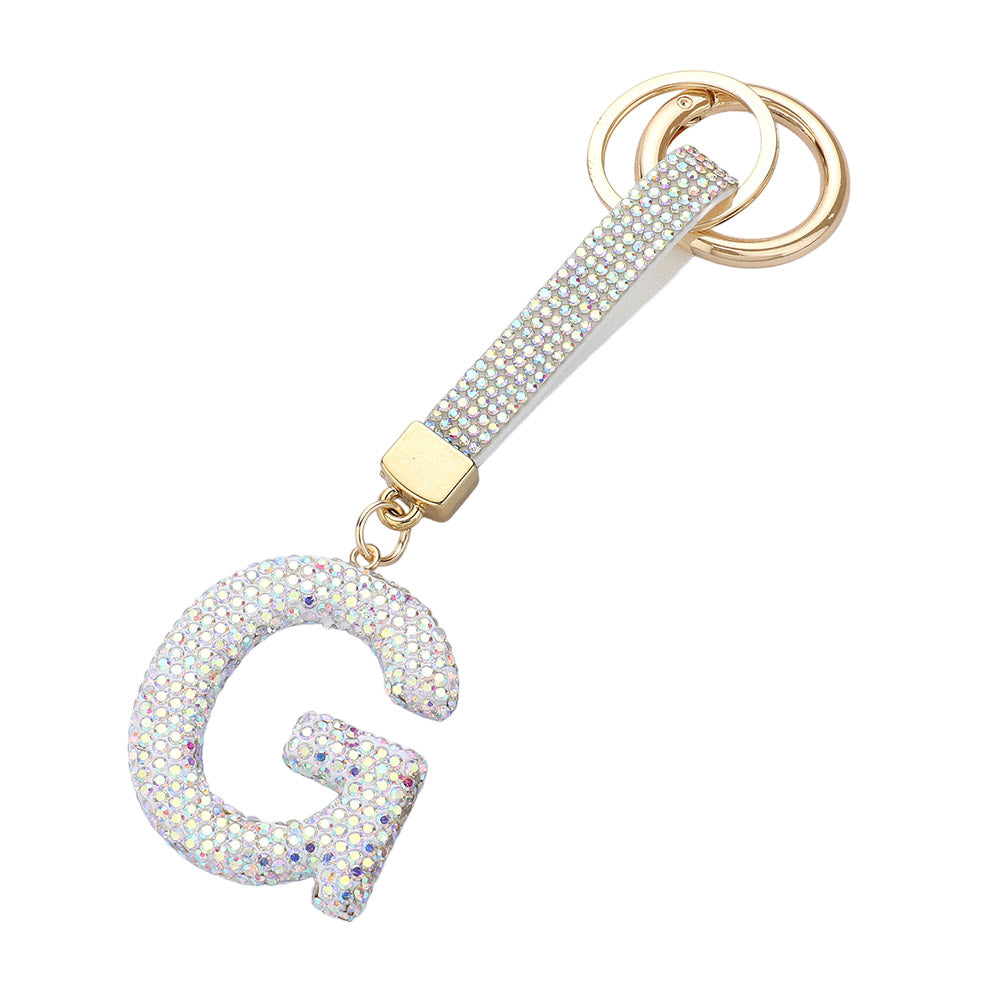 AB- Bling Studded Monogram Initial F Bag Charm adds a touch of elegance and personalization to any bag. Crafted with sparkling studs and featuring a monogram initial, this charm is the perfect accessory for the fashion-forward individual. Show off your unique style with this statement piece.