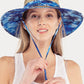 Blue C.C. SUN HAT provides stylish and functional protection from the sun. Made with high-quality materials, this hat offers a comfortable fit and UPF 50+ sun protection. Ideal for outdoor activities, it shields your face and neck from harmful UV rays.
