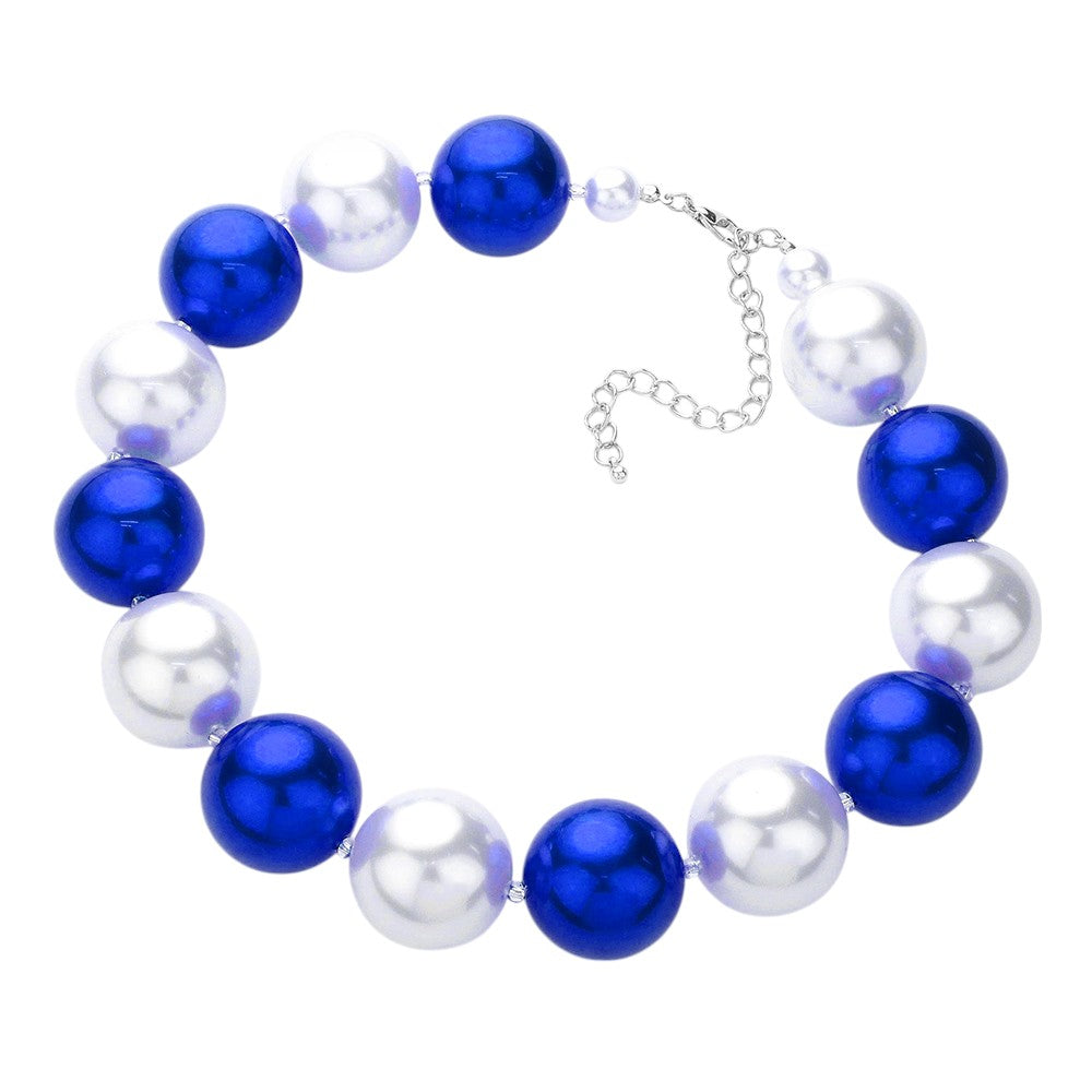 Blue Chunky Pearl Necklace boasts a bold and elegant design. With its chunky pearls, this necklace adds a touch of sophistication to any outfit. The large pearls create a timeless and classic look, perfect for any occasion. Elevate your style with this stunning piece of jewelry.