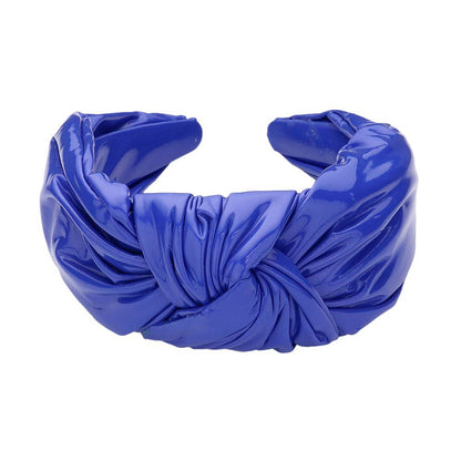 Blue Faux Shiny Leather Knot Headband, the perfect accessory for adding a touch of elegance to any outfit. Made from high-quality faux leather, this headband boasts a sleek and shiny finish. Its knot design adds a unique and stylish touch. This shiny headband is a perfect gift accessory for your loved ones.