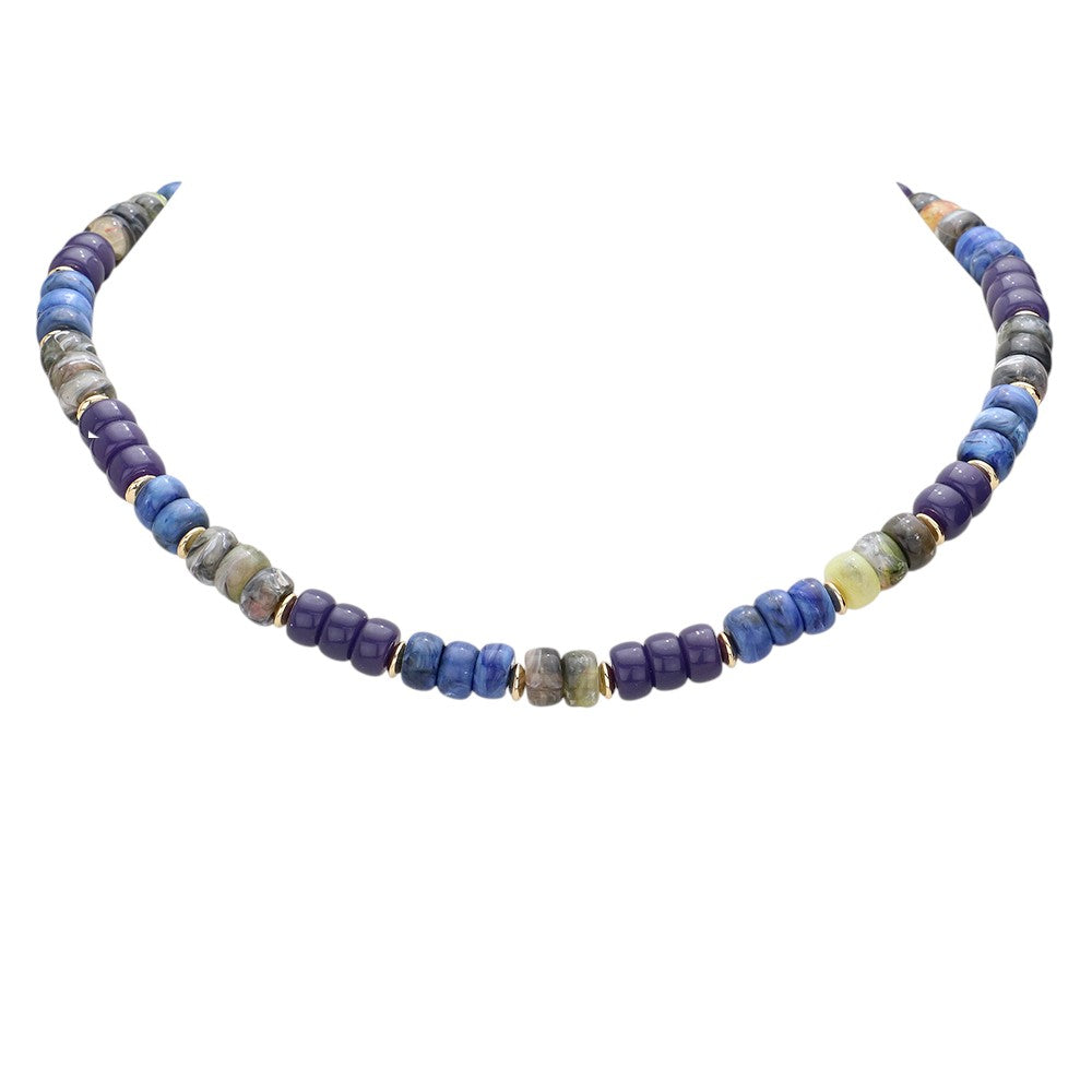 Blue Gold  Chunky Beaded Necklace is a versatile and stylish accessory for any outfit. Made with chunky beads, it adds a touch of elegance and texture to your look. Its bold design makes a statement while being comfortable to wear. Elevate your fashion sense with this eye-catching necklace.