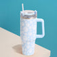 Blue Happy Face Printed 40oz Stainless Steel Tumbler With Handle is perfect for keeping your drinks hot or cold for hours. Made of durable stainless steel and featuring a fun happy face print, this tumbler is a great addition to your drinkware collection. With its large 40oz capacity and convenient handle, you can enjoy your favorite beverages on the go while spreading joy and happiness.