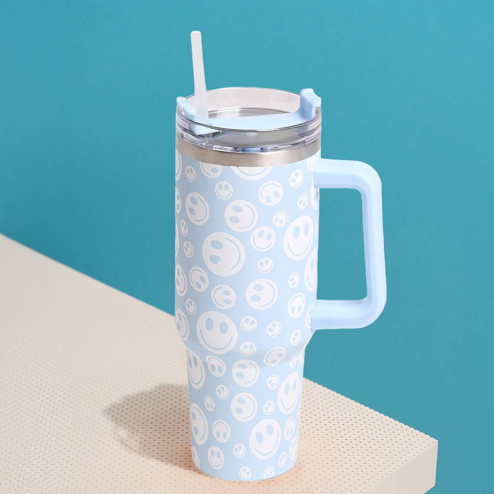 Blue Happy Face Printed 40oz Stainless Steel Tumbler With Handle is perfect for keeping your drinks hot or cold for hours. Made of durable stainless steel and featuring a fun happy face print, this tumbler is a great addition to your drinkware collection. With its large 40oz capacity and convenient handle, you can enjoy your favorite beverages on the go while spreading joy and happiness.