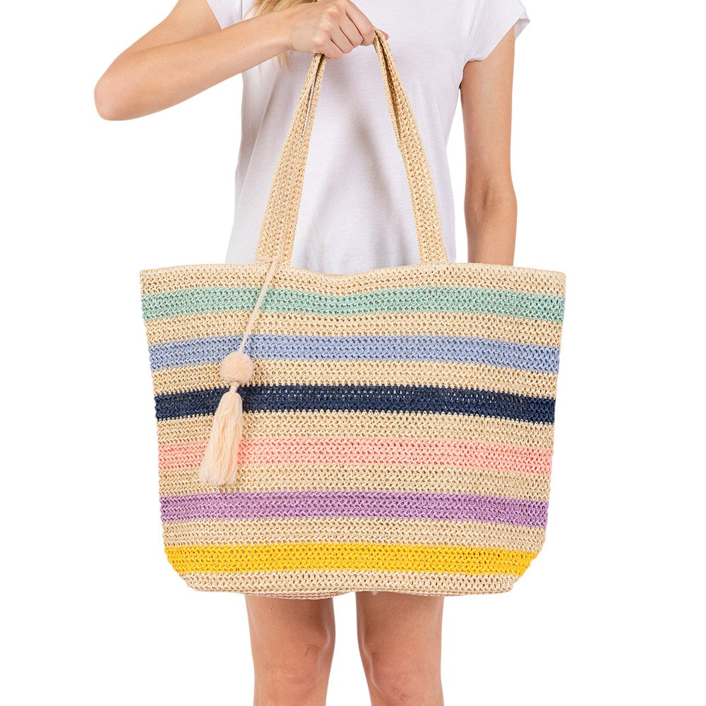 Blue Pom Pom Tassel Multi Color Striped Straw Crochet Tote Bag is a stylish and versatile accessory. Made with durable straw and adorned with playful pom poms and tassels, it adds a touch of fun to any outfit. Perfect for carrying essentials on a day out, it's also a great beach or picnic bag.