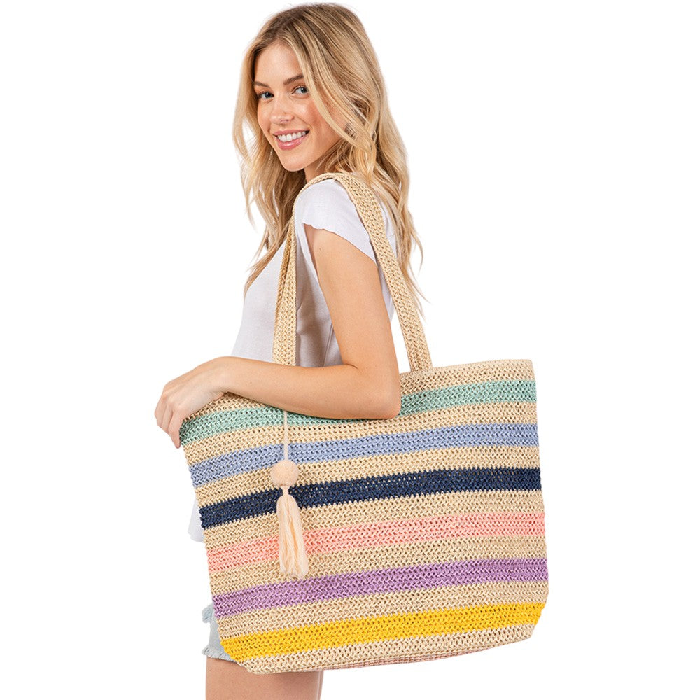 Blue Pom Pom Tassel Multi Color Striped Straw Crochet Tote Bag is a stylish and versatile accessory. Made with durable straw and adorned with playful pom poms and tassels, it adds a touch of fun to any outfit. Perfect for carrying essentials on a day out, it's also a great beach or picnic bag.