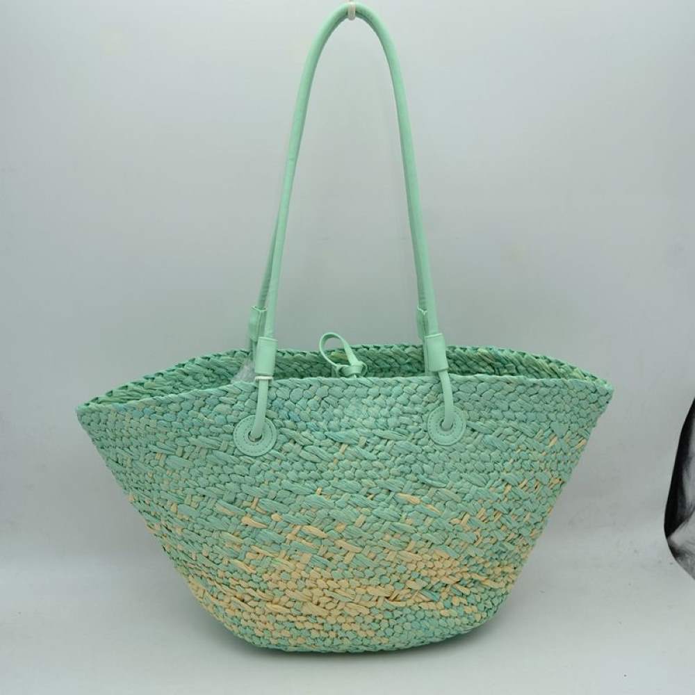bLUE This everyday tote bag features a spacious, flared silhouette with a distinctive textured, woven pattern throughout the body. Designed for convenient daily carrying, it comes equipped with dual long, slim shoulder straps secured to the panels via tonal circular stitched anchors. The open top design reveals a central loop fastening detail along the upper rim, offering a minimalist accent to the generous main storage compartment