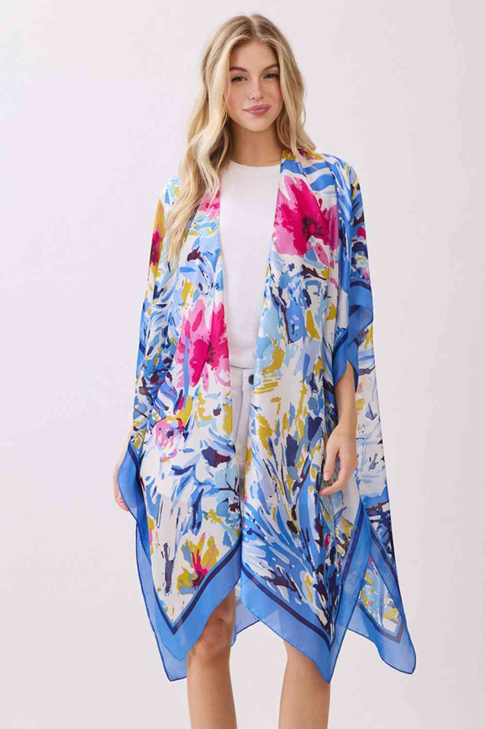 Blue Effortless elegance meets comfort in this abstract floral kimono cover-up. Crafted from 100% polyester with a luxuriously silky feel, it features a vibrant floral print accented by solid color edges for a polished look. Perfect for layering over swimwear, loungewear, or casual outfits, this versatile piece transitions seamlessly from beach to brunch. Generous 35" x 36" dimensions provide flattering coverage and easy movement. An essential wardrobe staple for any season.