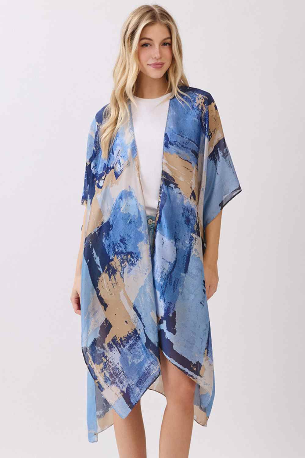 Blue Elevate your beach or resort wardrobe with this stunning Abstract Modern Art-Inspired Print Kimono. Crafted from 100% polyester with a luxuriously silky feel, this cover-up drapes beautifully over swimwear or casual outfits. The bold, contemporary print adds an artistic flair to any look, while the generous 35" x 36" dimensions provide comfortable coverage. Perfect for poolside lounging, beach days, or layering over your favorite pieces. Lightweight and easy to care for, this kimono is an effortless wa