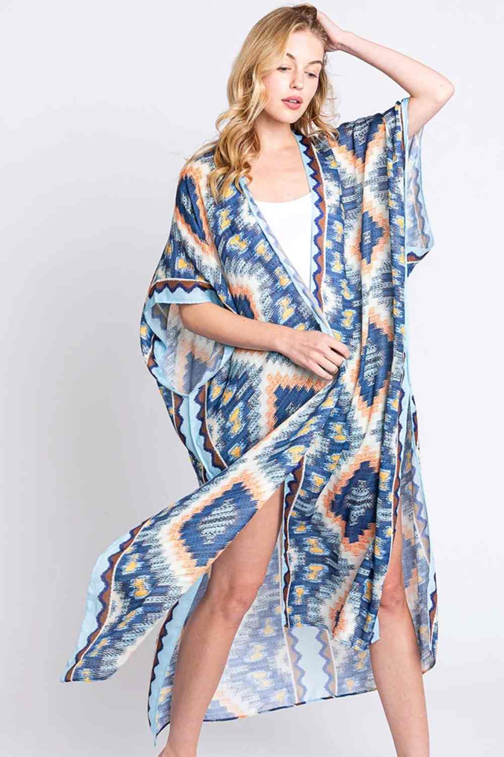 Blue Embrace bohemian elegance with this Aztec Print Open Front Long Kimono. Featuring a striking geometric pattern inspired by traditional Aztec designs, this lightweight piece drapes beautifully over any outfit. The open front silhouette offers effortless layering versatility, while the generous 35" x 47.5" dimensions provide comfortable coverage. Crafted from 100% polyester for easy care and durability. Perfect for adding texture and cultural flair to your everyday wardrobe or beach getaway.