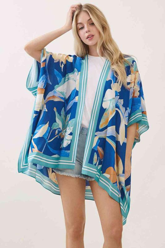 Blue Effortless elegance meets bohemian charm with this stunning floral print kimono cover up. Crafted from 100% viscose, the fabric drapes beautifully while offering a soft, breathable feel perfect for layering over swimwear or casual outfits. The generous 40" x 60" dimensions provide comfortable coverage and movement. Whether you're heading to the beach, poolside, or embracing a relaxed weekend look, this versatile piece brings an artistic, free-spirited vibe to any wardrobe.
