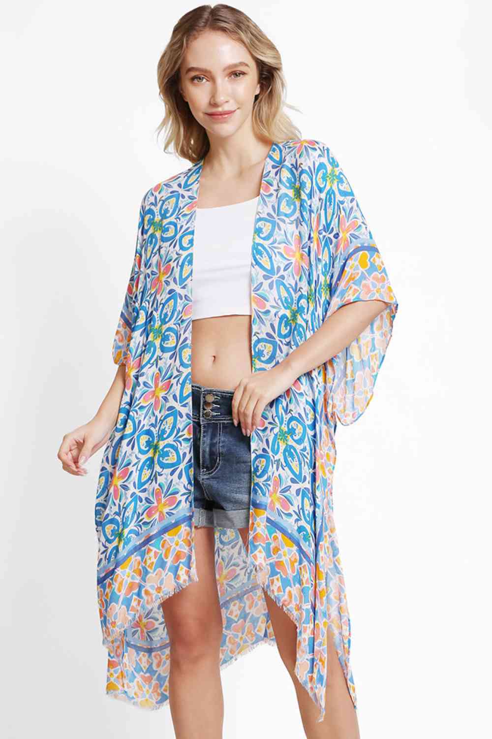 Blue Effortless elegance meets summer style with this floral abstract pattern kimono cover up. Crafted from 100% viscose, the lightweight fabric drapes beautifully while keeping you cool and comfortable. Perfect for beach days, poolside lounging, or casual outings, this versatile piece layers seamlessly over swimwear or light clothing. The generous 38" x 39" dimensions provide relaxed, flowing coverage. A timeless addition to any warm-weather wardrobe.