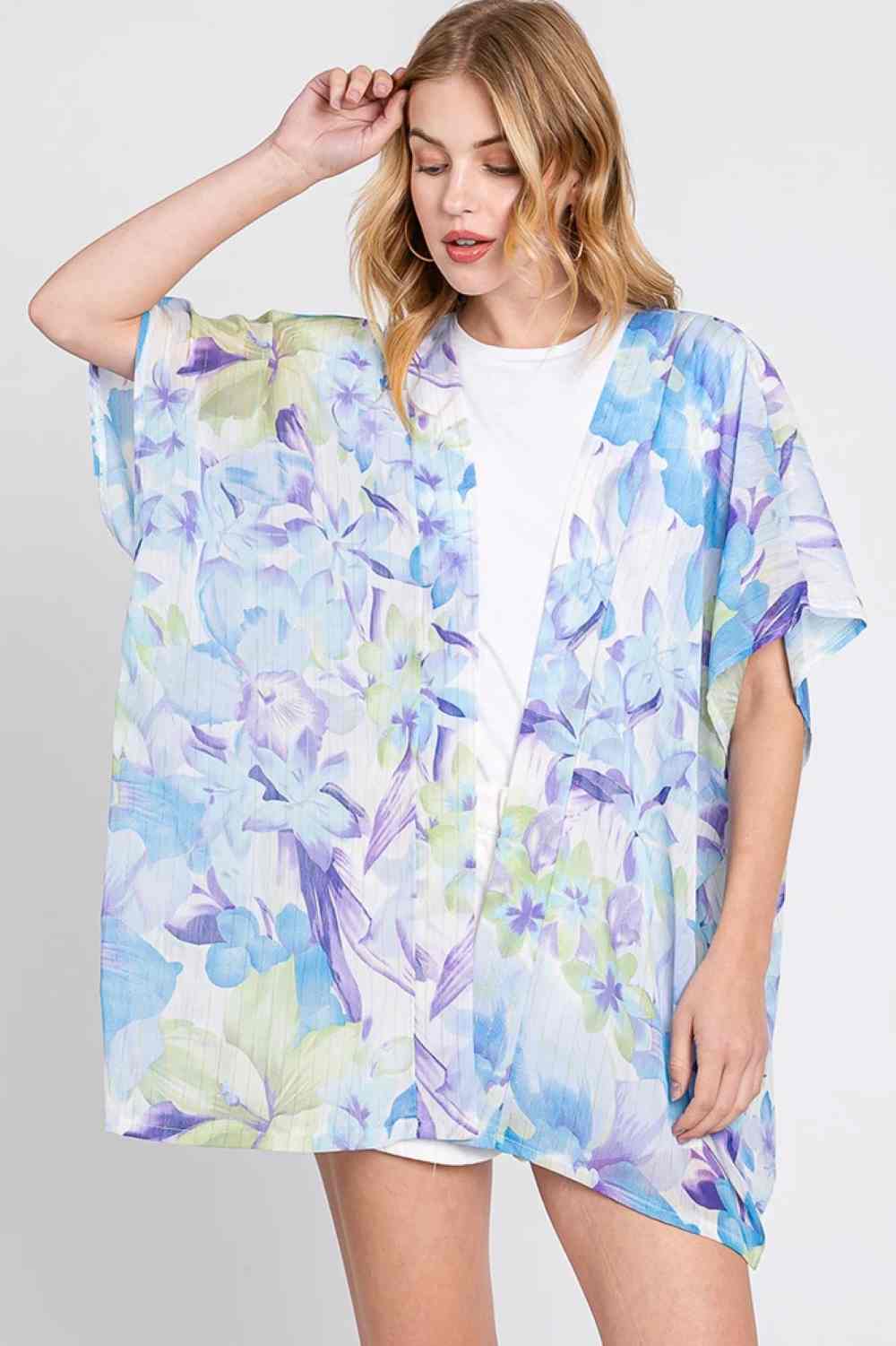 Blue Effortless elegance meets comfort in this floral print cover up cardigan. Crafted from lightweight 100% polyester, it drapes beautifully over your favorite outfits for a polished, layered look. Perfect for beach days, casual outings, or adding dimension to any ensemble. Generously sized at 35" x 27.5" for a relaxed, flattering fit. An easy-to-wear essential that transitions seamlessly from season to season.