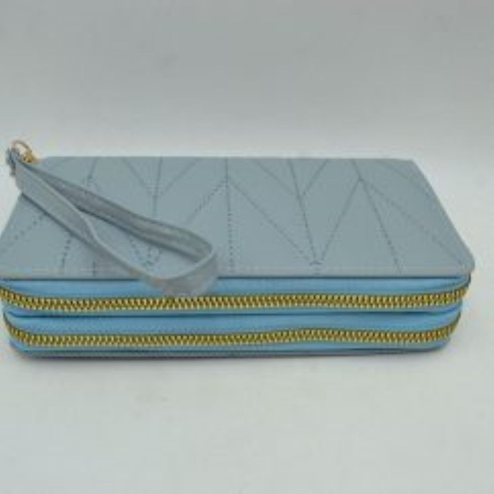 Blue This rectangular long wallet features a distinctive geometric stitched pattern across its exterior, providing a refined and structured look for everyday use. Designed to offer organized storage compartments, it incorporates a dual zip-around closure system with prominent metallic zippers to keep essentials secure. A matching, detachable flat wristlet strap is connected to the side hardware with a metallic clasp, providing an easy and convenient hands-free carrying style.