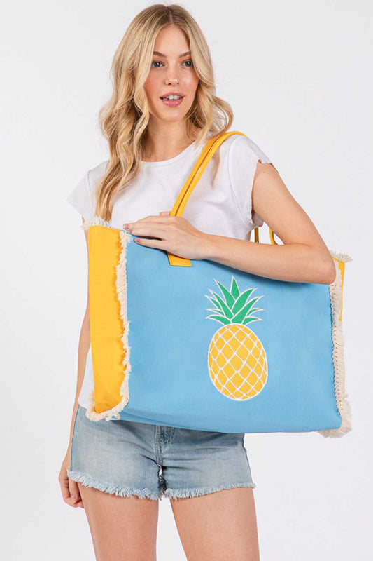 Blue Carry summer style with this vibrant pineapple embroidered tote. Crafted from durable 100% polyester, this spacious bag measures 17.5" x 14" x 5" and features a charming fringe design detail. The secure magnetic closure keeps your essentials safe, while an inner pocket adds convenient organization. Perfect for beach days, farmers markets, or everyday adventures. Made in China.