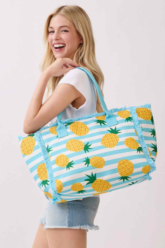 Blue Carry your essentials in style with this charming pineapple-print medium tote bag. Featuring a vibrant stripe pattern and playful fringe detailing, it's the perfect companion for shopping, travel, or everyday use. Crafted from durable 100% polyester, this spacious tote measures 14.5" x 11.5" x 7" and includes a secure zipper closure and convenient inner pocket for organized storage. A fun, functional accessory that brings tropical flair to any outfit.