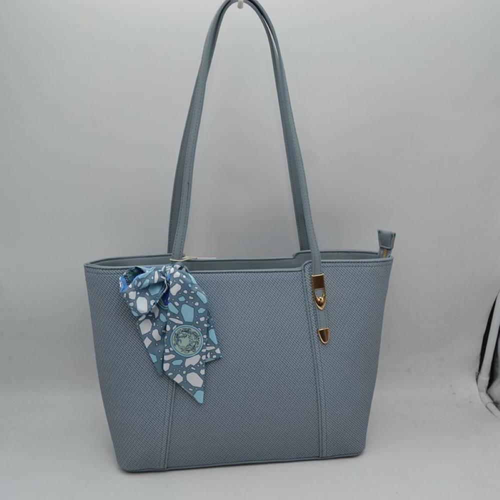 Blue Bring a touch of effortless resort-chic into your daily routine with this stunning cream and cognac shoulder tote. Designed with an elegant chevron-textured weave and beautifully contrasted by rich, warm tan accents, this bag is the ultimate fusion of classic sophistication and everyday practicality. Perfect for office styling, weekend getaways, or casual city strolls, it arrives detailed with a colorful, artistic silk-style scarf playfully tied to the handle for an immediate touch of luxury.