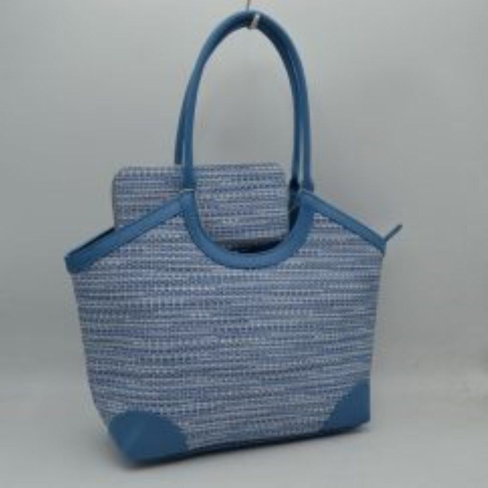Blue Infuse your daily routine with classic sophistication with this elegant two-piece handbag set, featuring a spacious shoulder tote and a matching zip-around wristlet wallet. The tote showcases a beautiful multi-tonal woven tweed pattern, sharply contrasted by clean, structured top borders and reinforced base corners that preserve its graceful shape. Designed with extra-long, arched shoulder straps that slip comfortably over your arm