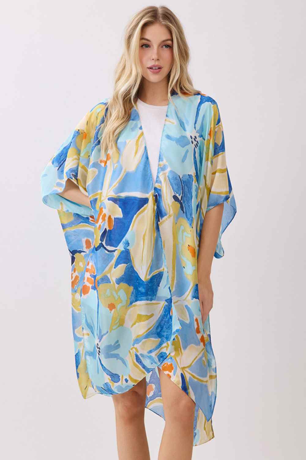 Blue Wrap yourself in effortless elegance with this vibrant botanic print kimono cover-up. Crafted from 100% polyester with a luxuriously silky feel, it drapes beautifully over swimwear, dresses, or casual outfits. The generous 35" x 36" dimensions provide comfortable coverage and movement. Perfect for beach days, resort wear, or layering during warmer months. A versatile piece that brings color and sophistication to any warm-weather wardrobe.