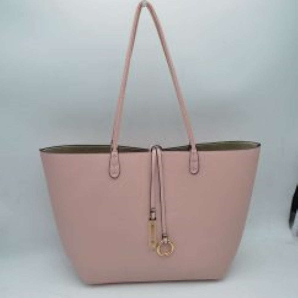 Blush-Silver This classic tote bag features a smooth exterior finish with a timeless trapeze silhouette, offering an elegant look for everyday use. Designed with an open top for quick access, the spacious main compartment provides ample storage space for daily essentials. Dual slim shoulder handles are securely stitched to the upper panels, while a decorative central drawstring tie accents the front, complete with a metallic ring and matching tab accent for a polished touch.