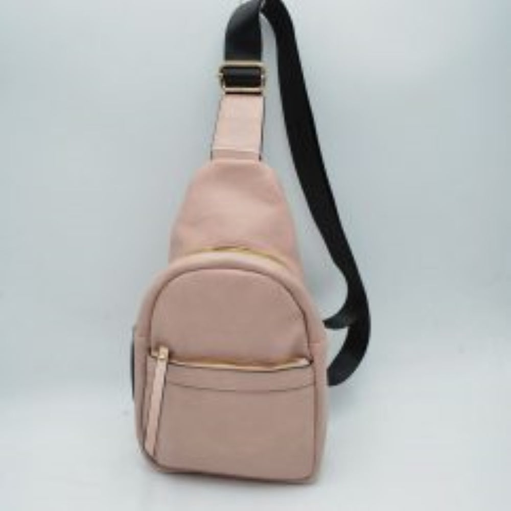 Blush This functional sling bag is designed for easy everyday use and hands-free convenience. It features multiple storage compartments, including a spacious main zippered section and a smaller front zippered pocket equipped with a long pull tab. An adjustable shoulder strap with a built-in slide buckle allows for a customizable fit, making it perfect for secure and comfortable carrying throughout the day.