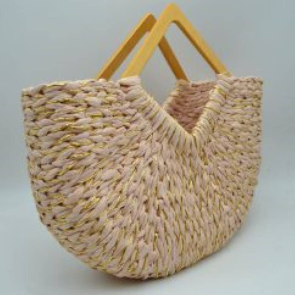 Blush This unique everyday tote bag features a thick woven basket design accented with interwoven shimmering metallic threads throughout the body. Crafted with a distinct curved silhouette that dips at the center, it opens to a spacious main storage compartment perfect for daily essentials.