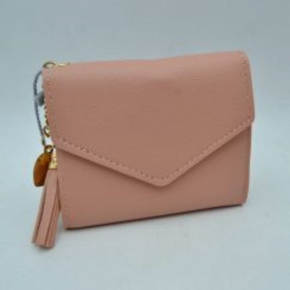 Blush This compact wallet features a classic envelope-style design with a distinctive V-shaped front flap and clean perimeter stitching, making it a stylish choice for everyday use. Designed to offer a streamlined storage solution for essential items, it maintains a sleek, structured silhouette that easily fits into larger bags or pockets. A decorative tassel charm with a metallic cap is attached to the side hardware, adding a functional and eye-catching accent to the understated design.