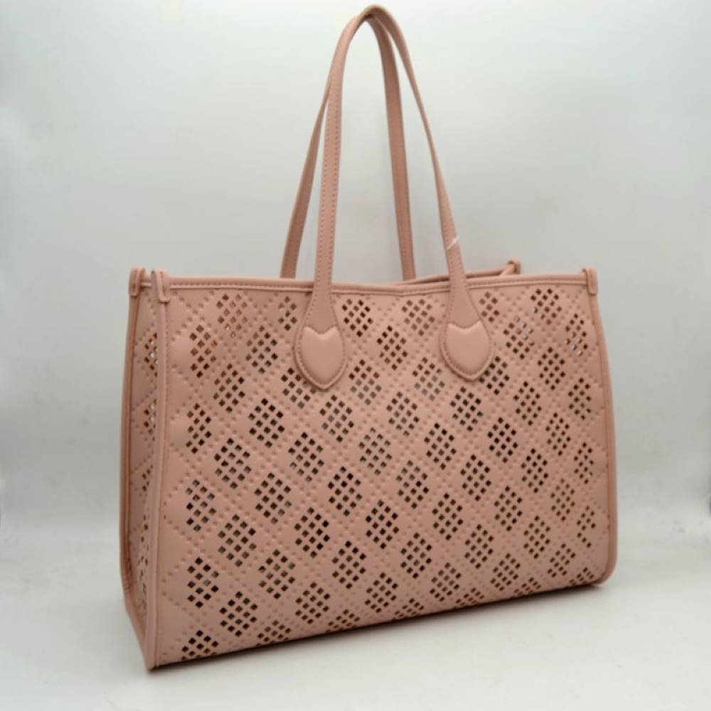 Blush Elevate your accessory game with this stunning black perforated tote. Combining architectural precision with everyday practicality, this bag features an intricate laser-cut lattice design that offers a modern, airy feel while maintaining a structured, high-end silhouette. Whether you're heading to a business meeting or a weekend brunch, this versatile tote is the perfect blend of edgy detail and classic sophistication.