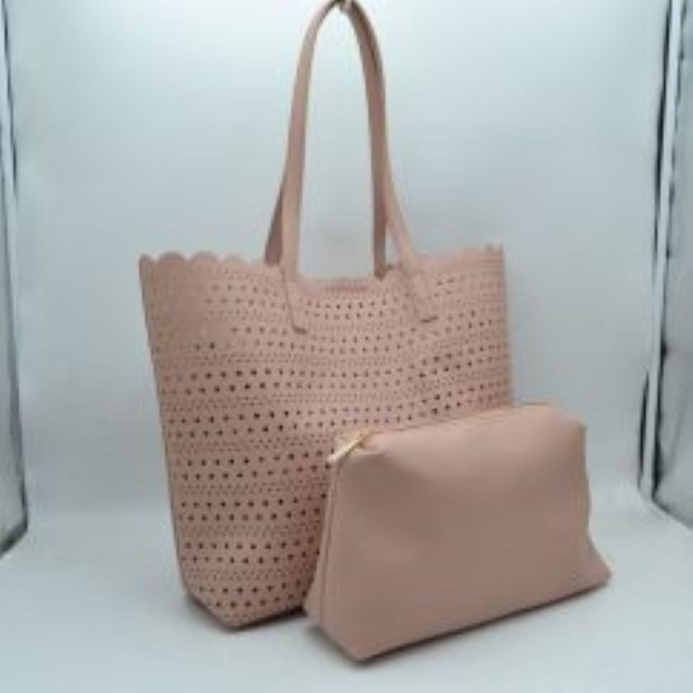 Blush Bring an airy, classic look to your everyday style with this elegant perforated tote bag. Featuring an all-over laser-cut geometric pattern arranged in neat horizontal rows, this handbag stands out with its feminine, scalloped top border. The generously sized interior offers plenty of room to hold your daily essentials, electronics, or beach necessities, making it a perfect match for seasonal travel, market runs, or casual daytime outings.