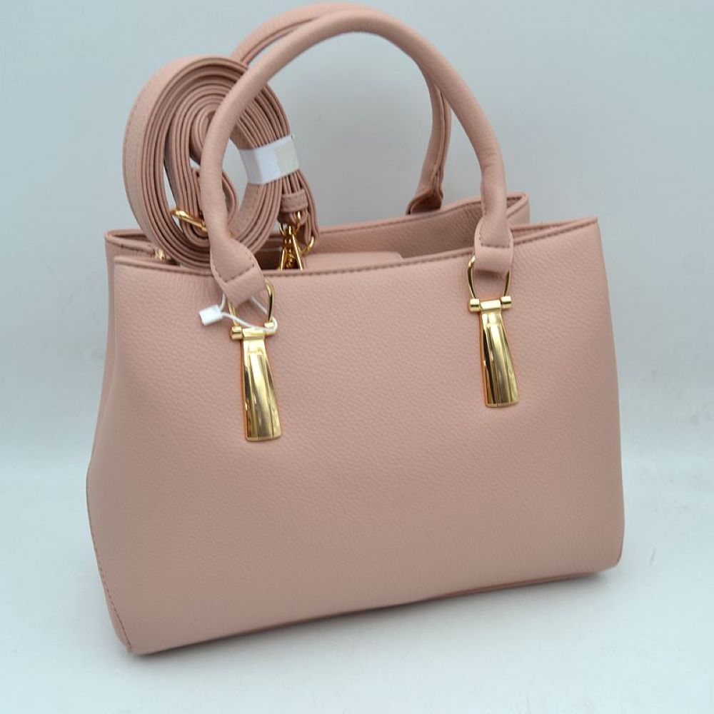 Blush This structured satchel features a clean silhouette and a finely textured exterior finish, making it a sophisticated choice for elevated everyday use. The front panel is detailed with unique, polished metallic vertical hardware attachments that secure the sturdy, rounded dual top handles for a classic hand carry. An open-top style provides convenient access to the main storage compartments