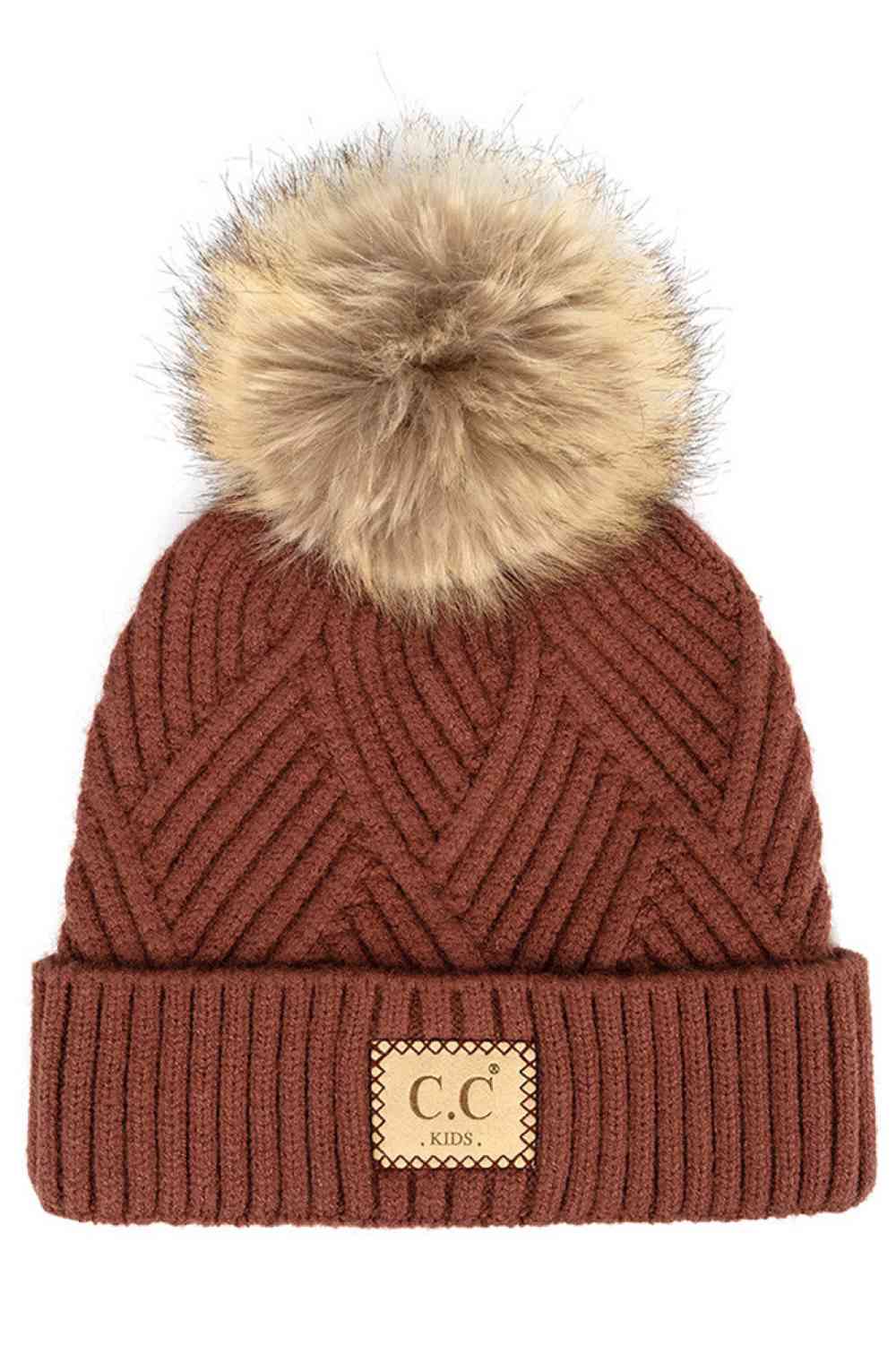 Brick Keep your little one cozy with this C.C Kids Knit Beanie, featuring a playful diagonal stripes criss-cross pattern. Crafted from a soft blend of 47% rayon, 31% PBT, and 22% nylon, this beanie offers warmth and durability for everyday wear.