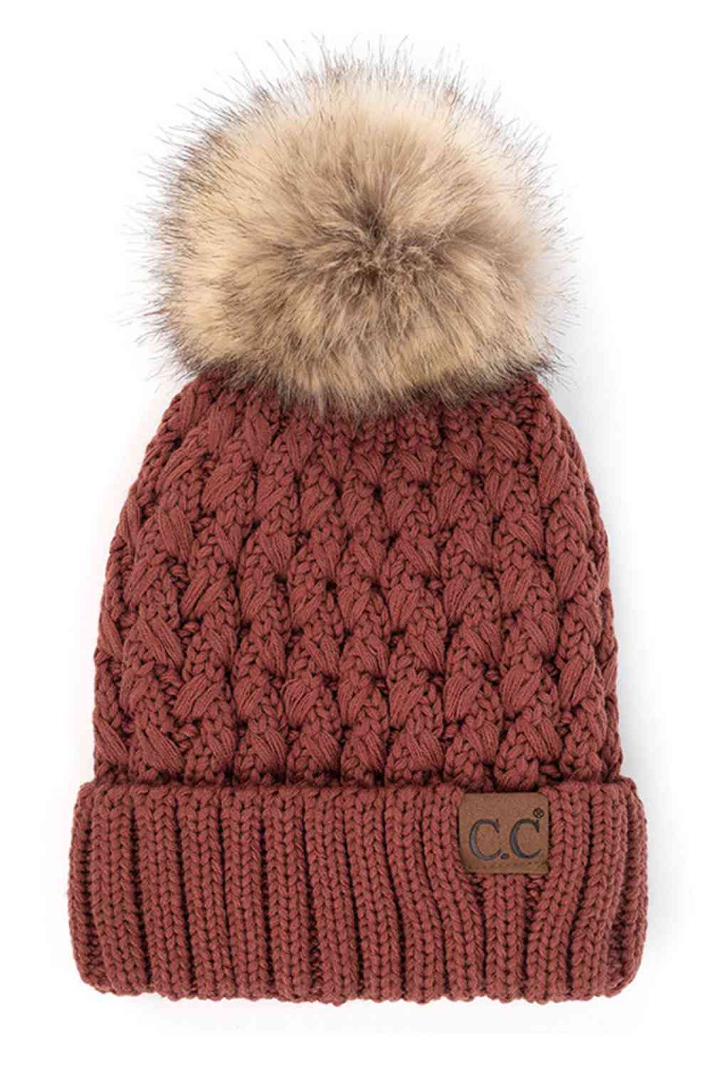 Brick Elevate your winter wardrobe with the C.C Lattice Crossover Stitch Beanie, featuring an intricate lattice pattern and cozy pom detail. Crafted from 100% soft acrylic, this beanie delivers warmth and comfort without the weight. The crossover stitch design adds visual interest while the relaxed fit suits most face shapes. Perfect for layering over your favorite winter looks, this versatile beanie transitions effortlessly from casual outings to outdoor adventures. One size fits most for easy, everyday we