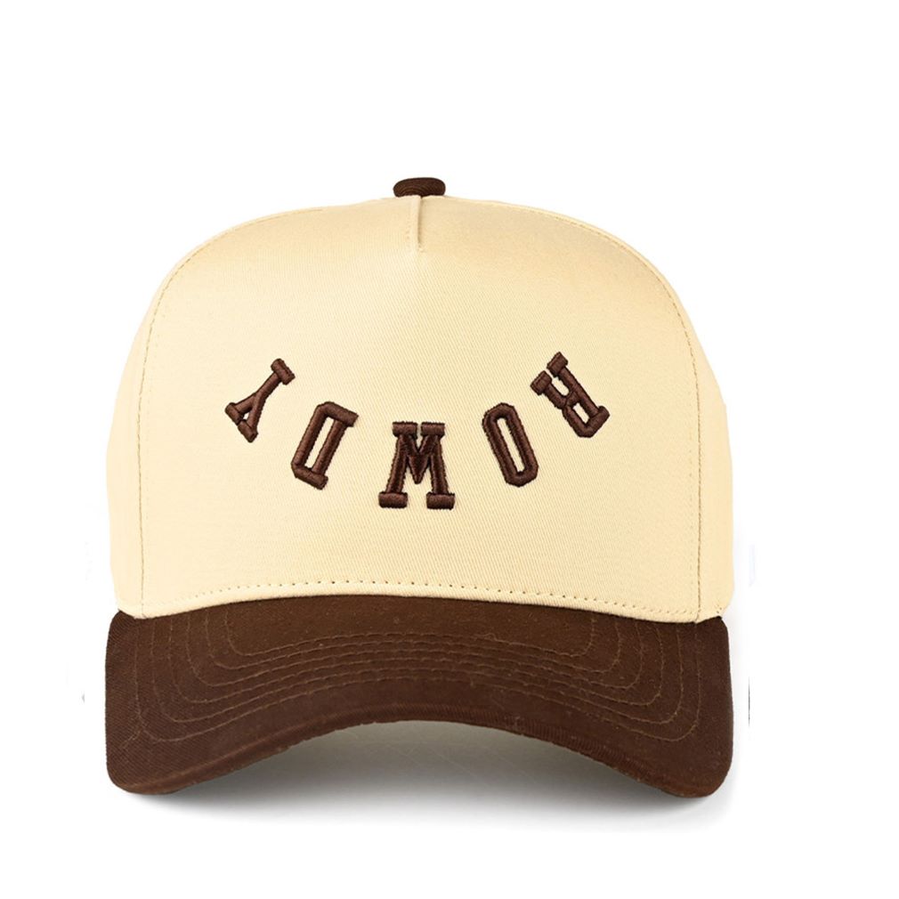 Brown Turn up the attitude with the C.C Rowdy two-tone trucker hat, featuring bold letter embroidery that brings fearless, sporty style to any outfit. Designed with a classic baseball cap silhouette and breathable mesh back, it offers comfortable all-day wear with an effortlessly cool finish.