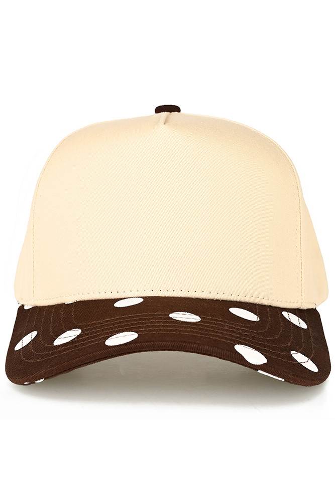 Classic style meets playful design with this C.C trucker hat. Bold big polka dots print the brim while two-tone construction adds visual interest and versatility. Structured mesh panels keep you cool and comfortable all day long, whether you're at the beach, running errands, or enjoying outdoor activities. The adjustable back strap ensures a secure, customizable fit for most head sizes. Fun, functional, and effortlessly stylish. Available Colors: Black, Brown, Navy, Red, White 100% Cotton Circumference: 22.