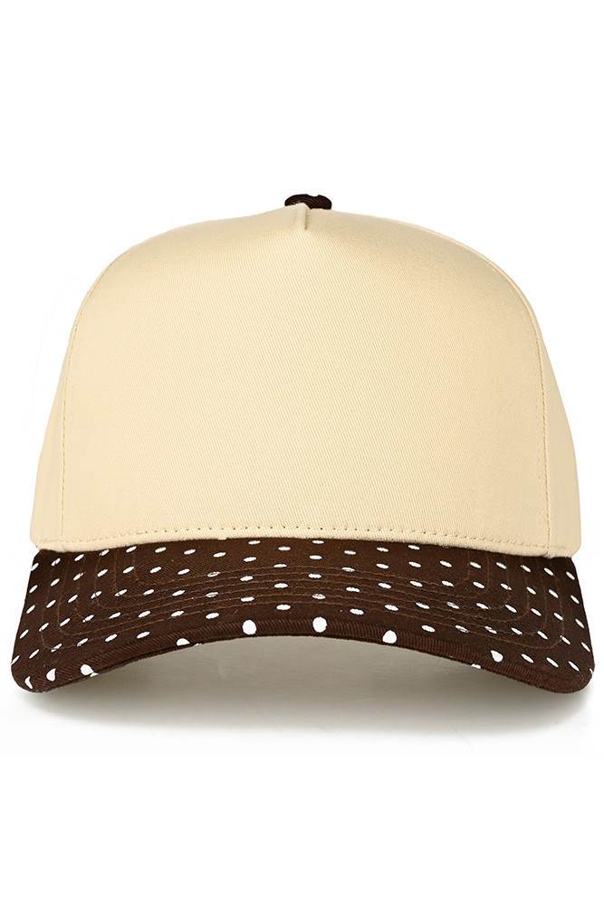 Classic style meets playful design with this C.C trucker hat. The small polka dot pattern adorns the brim, while the two-tone construction adds visual interest and versatility. Structured mesh panels provide breathability for all-day wear, making it perfect for casual outings, outdoor activities, or everyday comfort. The adjustable back ensures a secure fit for most head sizes. Whether you're heading to the beach, running errands, or just want a fun accessory, this hat delivers both style and function.