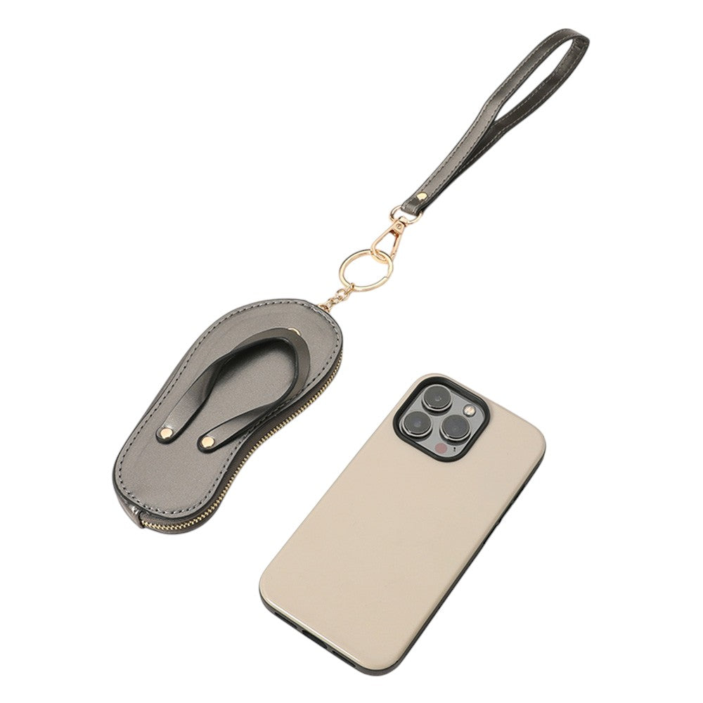 Brown Faux Leather Flip-flop Mini Wristlet Bag Charm Coin Purse offers a convenient and stylish way to carry your essentials. Made from durable faux leather, this mini wristlet bag doubles as a charm for your larger bag. Keep your coins, keys, or credit cards easily accessible with this sleek and functional accessory.